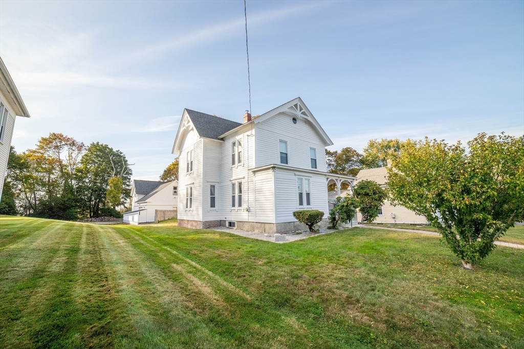 145 Center Road Dudley, MA 01571 - Photo 29 of 32 a view of a house with a big yard and large trees