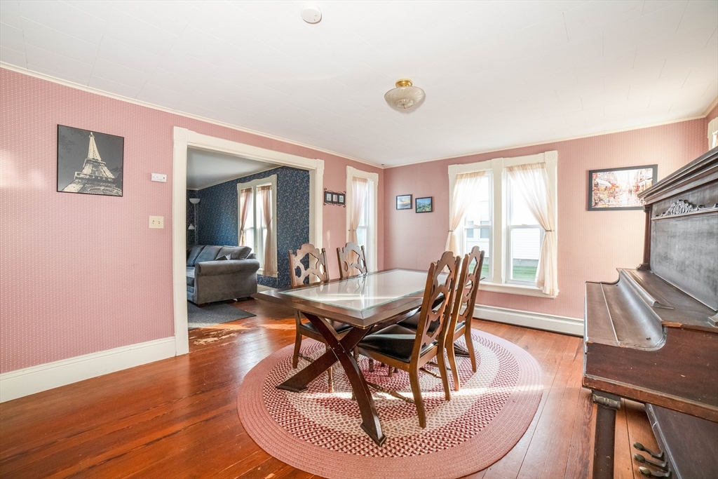 145 Center Road Dudley, MA 01571 - Photo 4 of 32 a dining room with furniture and wooden floor