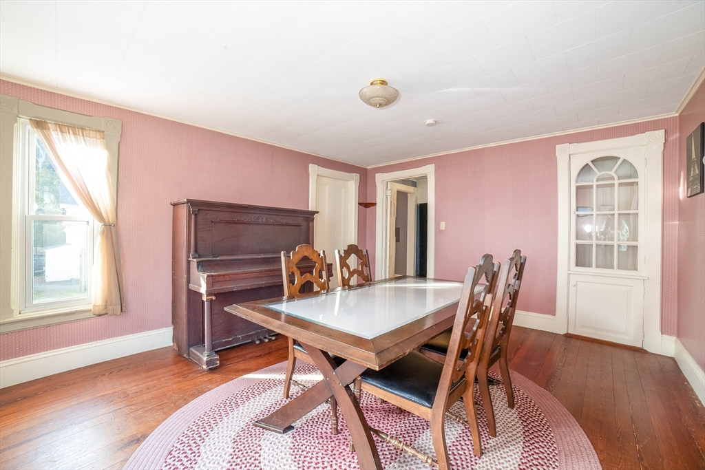 145 Center Road Dudley, MA 01571 - Photo 5 of 32 a view of a workspace with furniture and a window