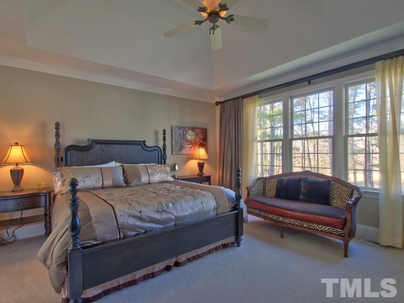 224 Waterville Street Raleigh, NC 27603 - Photo 12 of 25 a bedroom with a bed and a couch