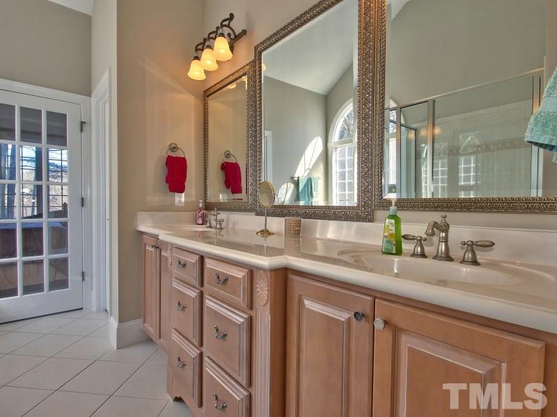224 Waterville Street Raleigh, NC 27603 - Photo 15 of 25 a bathroom with a sink and a mirror