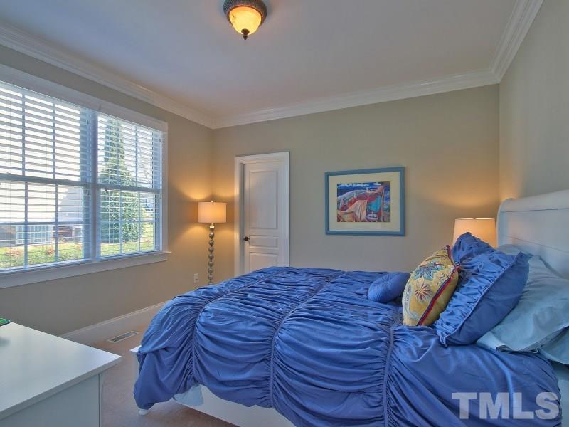 224 Waterville Street Raleigh, NC 27603 - Photo 17 of 25 a bedroom with a bed and a window