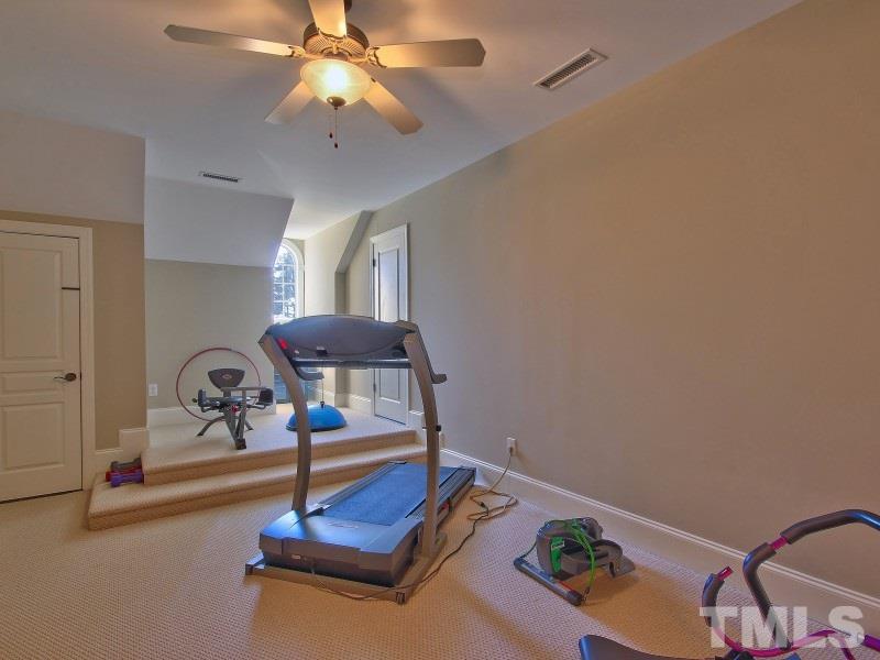 224 Waterville Street Raleigh, NC 27603 - Photo 20 of 25 a living room with furniture and a chandelier