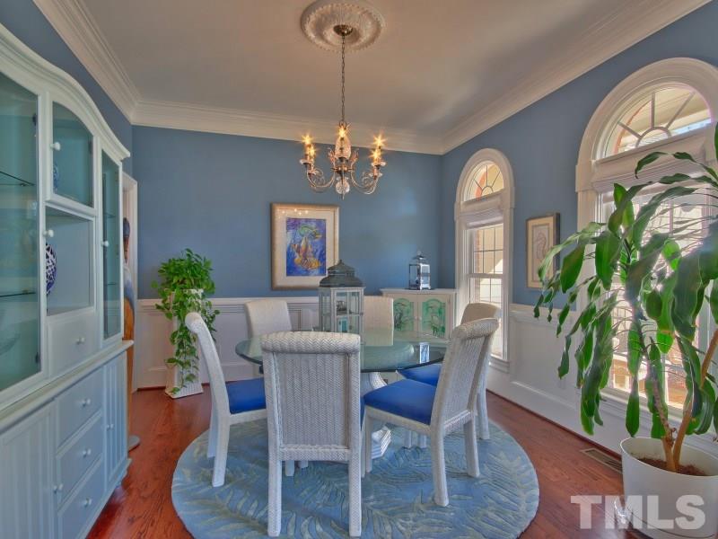 224 Waterville Street Raleigh, NC 27603 - Photo 3 of 25 a view of a dining room with furniture and a chandelier