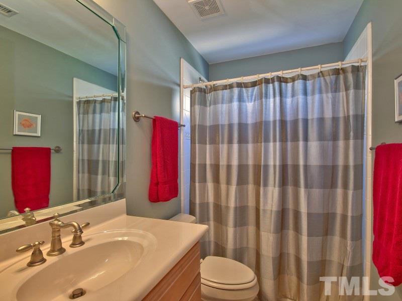 224 Waterville Street Raleigh, NC 27603 - Photo 21 of 25 a bathroom with a sink toilet and shower