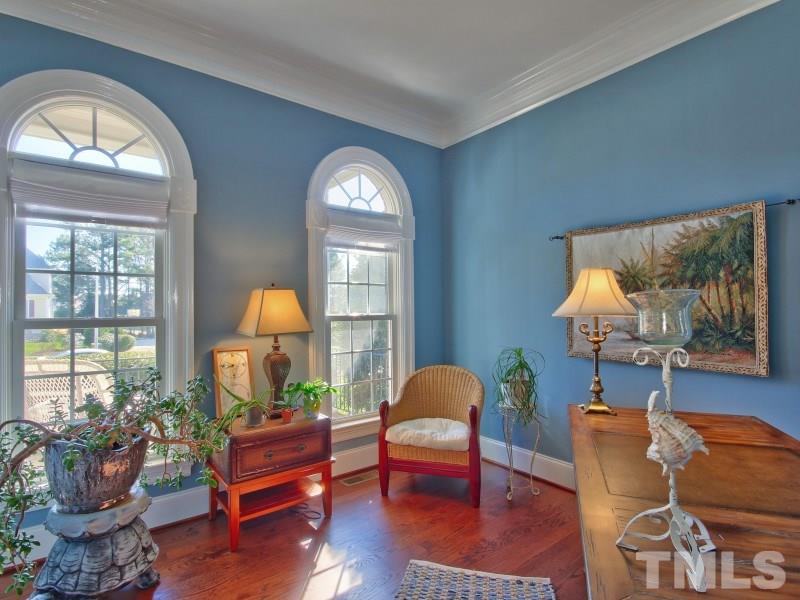 224 Waterville Street Raleigh, NC 27603 - Photo 4 of 25 a living room with furniture a window and a flat screen tv