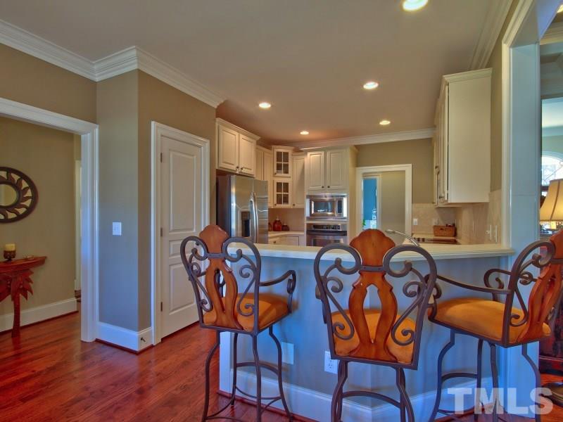 224 Waterville Street Raleigh, NC 27603 - Photo 5 of 25 a view of a dining room with furniture and wooden floor