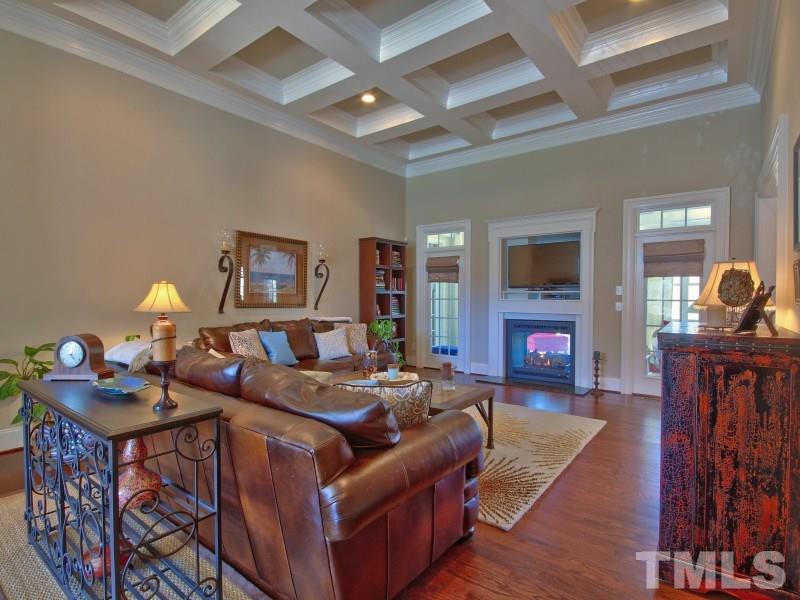 224 Waterville Street Raleigh, NC 27603 - Photo 9 of 25 a living room with fireplace furniture and a flat screen tv