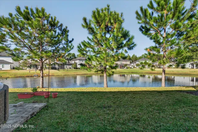 a view of multiple houses with swimming pool
