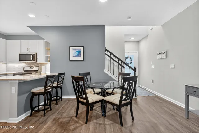 a kitchen with a sink stove and microwave
