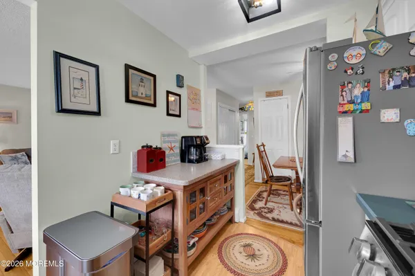 a view of a room that has a couch and a stove in it