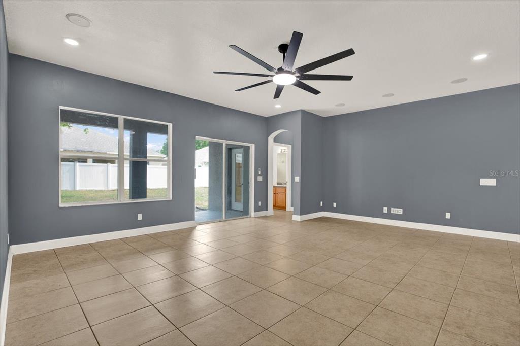 13397 Hunters Point Street Spring Hill, FL 34609 - Photo 14 of 38 a view of an empty room with a window