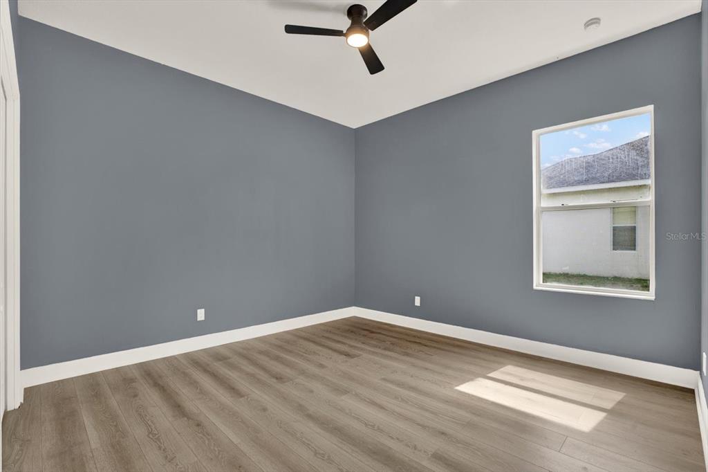 13397 Hunters Point Street Spring Hill, FL 34609 - Photo 20 of 38 a view of an empty room with a window