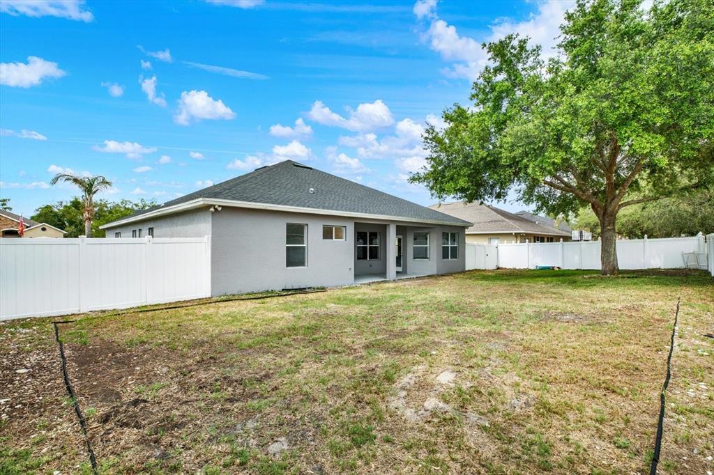 13397 Hunters Point Street Spring Hill, FL 34609 - Photo 2 of 38 a house with trees in the background