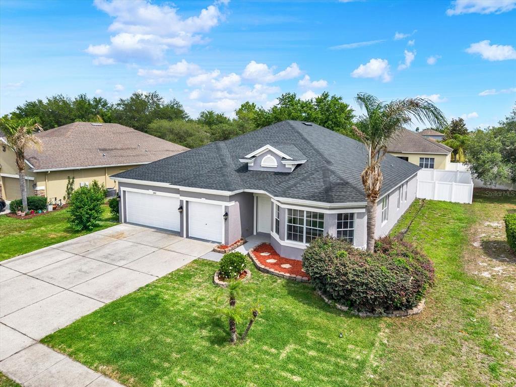 13397 Hunters Point Street Spring Hill, FL 34609 - Photo 30 of 38 a aerial view of a house with a yard and table