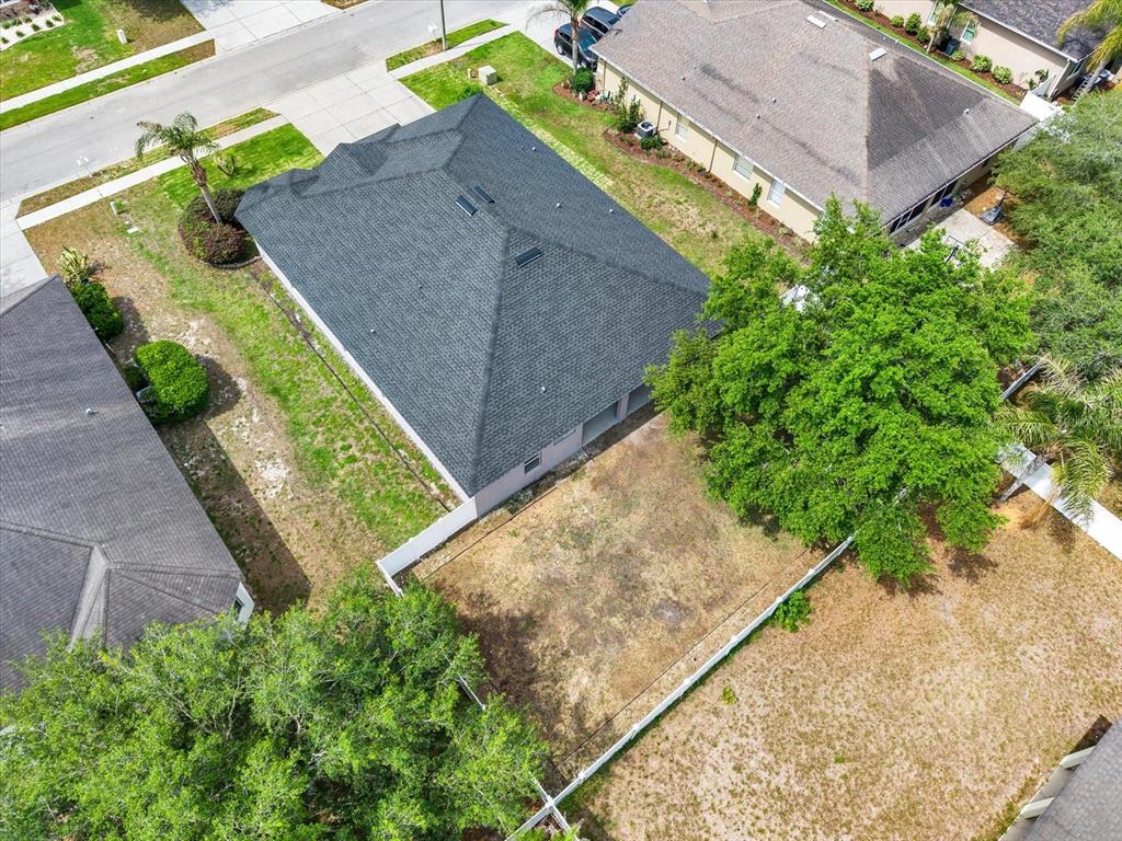13397 Hunters Point Street Spring Hill, FL 34609 - Photo 31 of 38 a view of a yard with potted plants