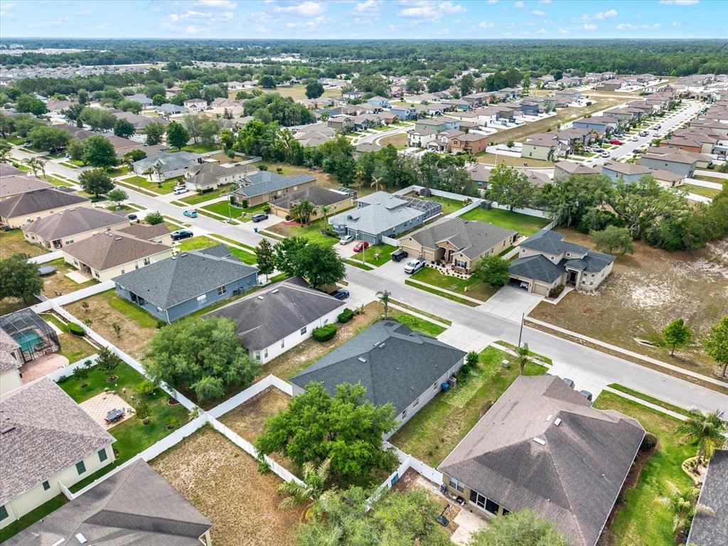 13397 Hunters Point Street Spring Hill, FL 34609 - Photo 32 of 38 an aerial view of residential houses with outdoor space