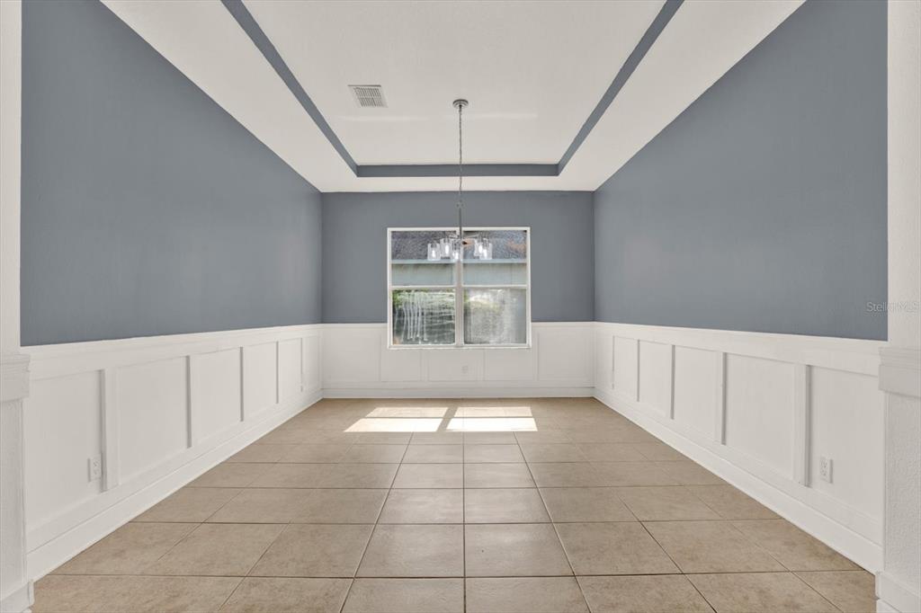 13397 Hunters Point Street Spring Hill, FL 34609 - Photo 4 of 38 a view of an empty room with a window
