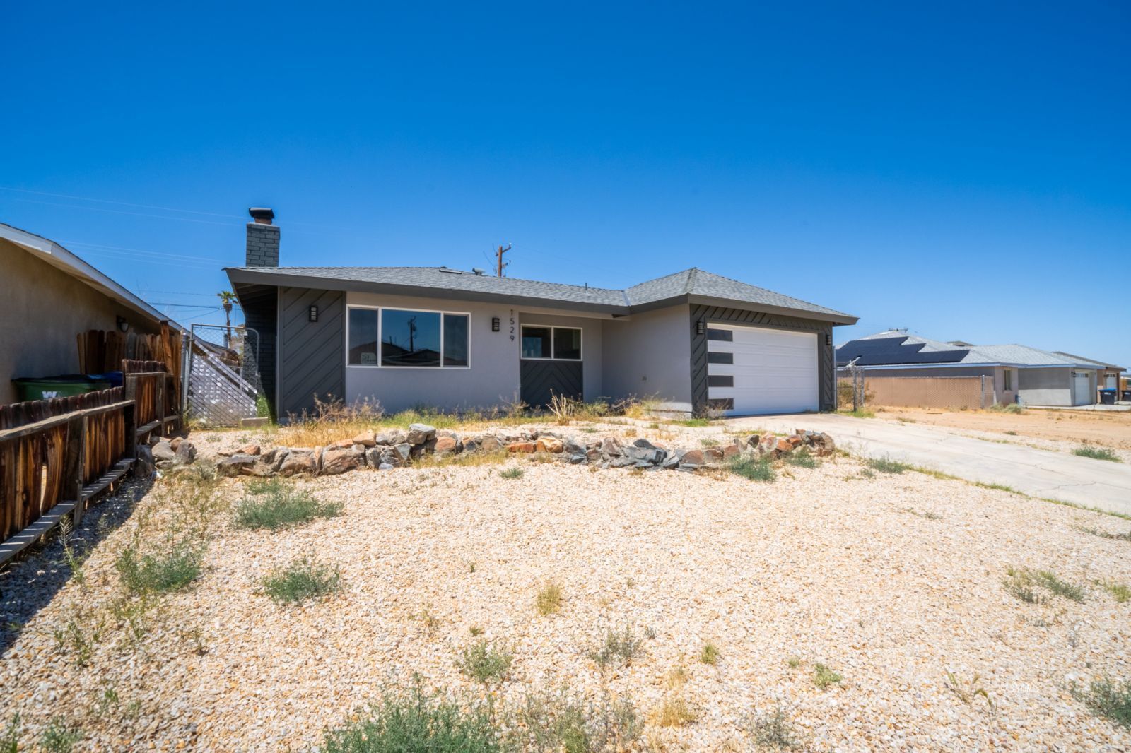 1529 Mayo Street Ridgecrest, CA 93555 - Photo 2 of 22 a view of a house with a snow in the yard