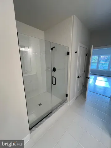 a bathroom with a double vanity sink and mirror