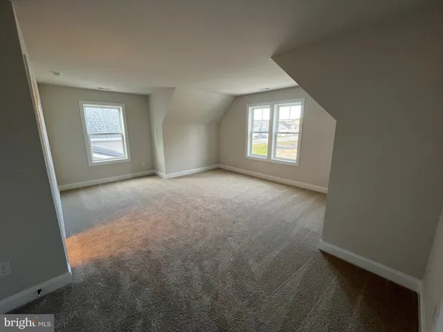 a bathroom with a sink a toilet a mirror and shower