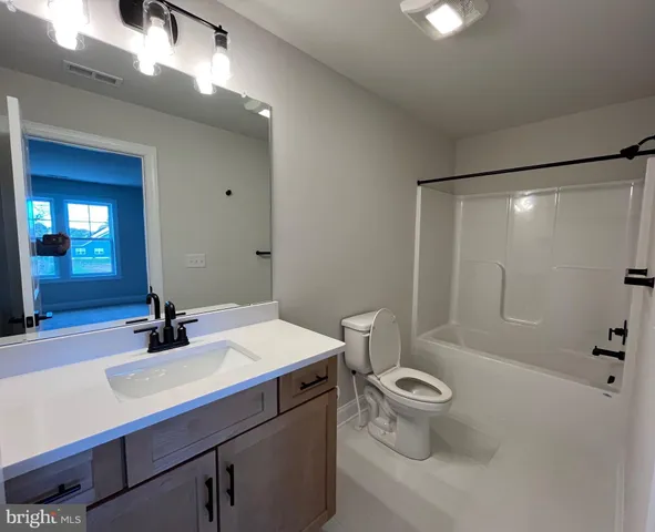 a view of a balcony with furniture