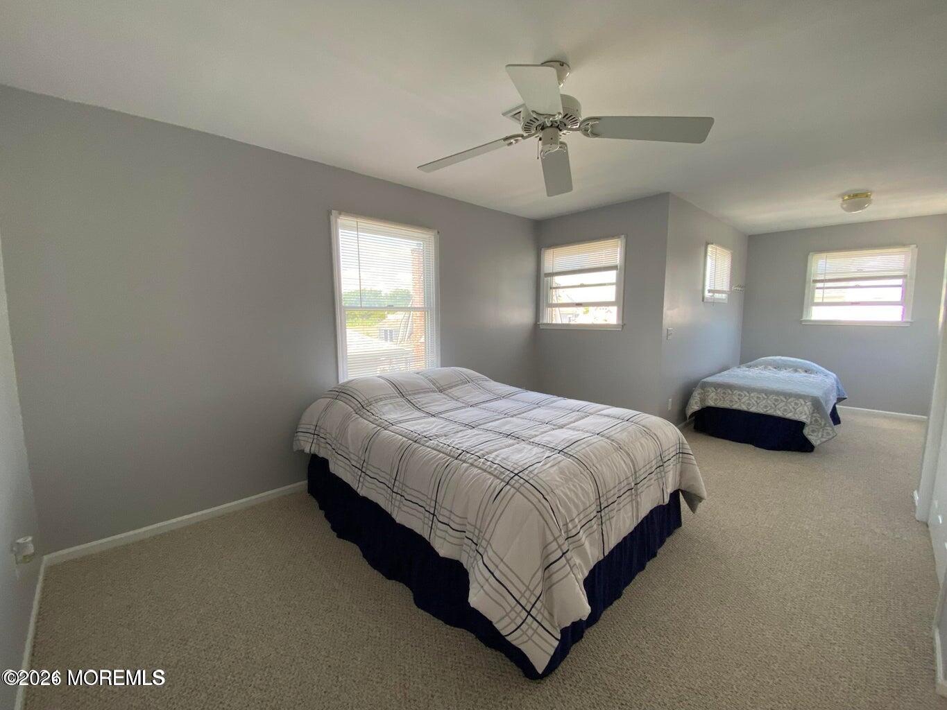 564 Perch Avenue Manasquan, NJ 08736 - Photo 11 of 15 a spacious bedroom with two beds and window