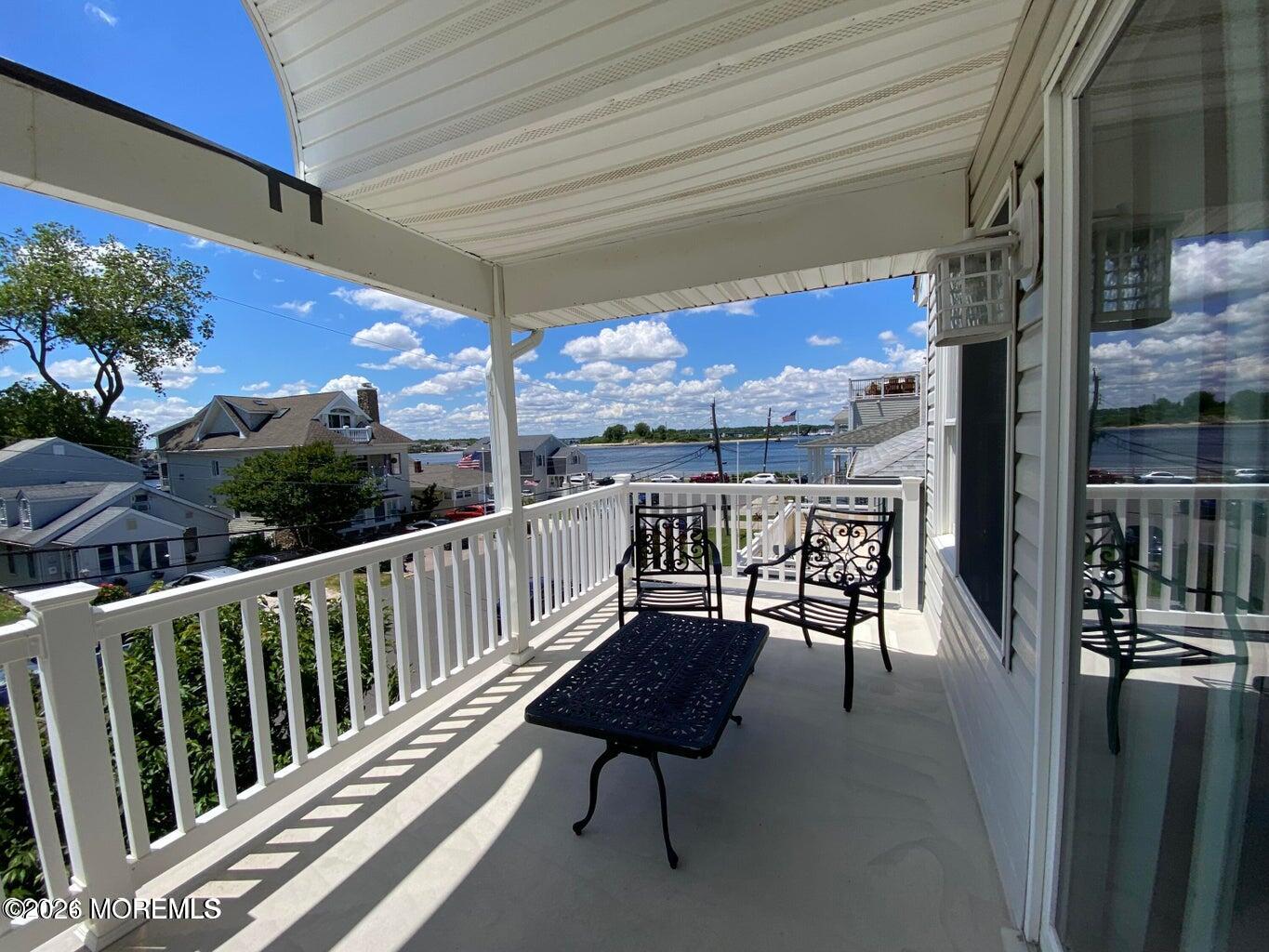 564 Perch Avenue Manasquan, NJ 08736 - Photo 14 of 15 a view of a chairs and table in the balcony