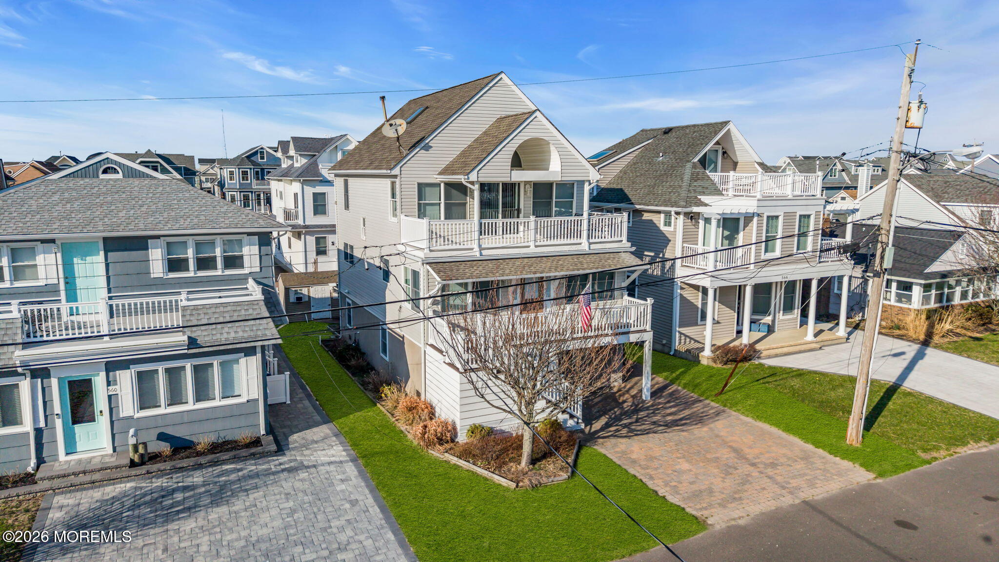 564 Perch Avenue Manasquan, NJ 08736 - Photo 2 of 15 a front view of a house with a yard