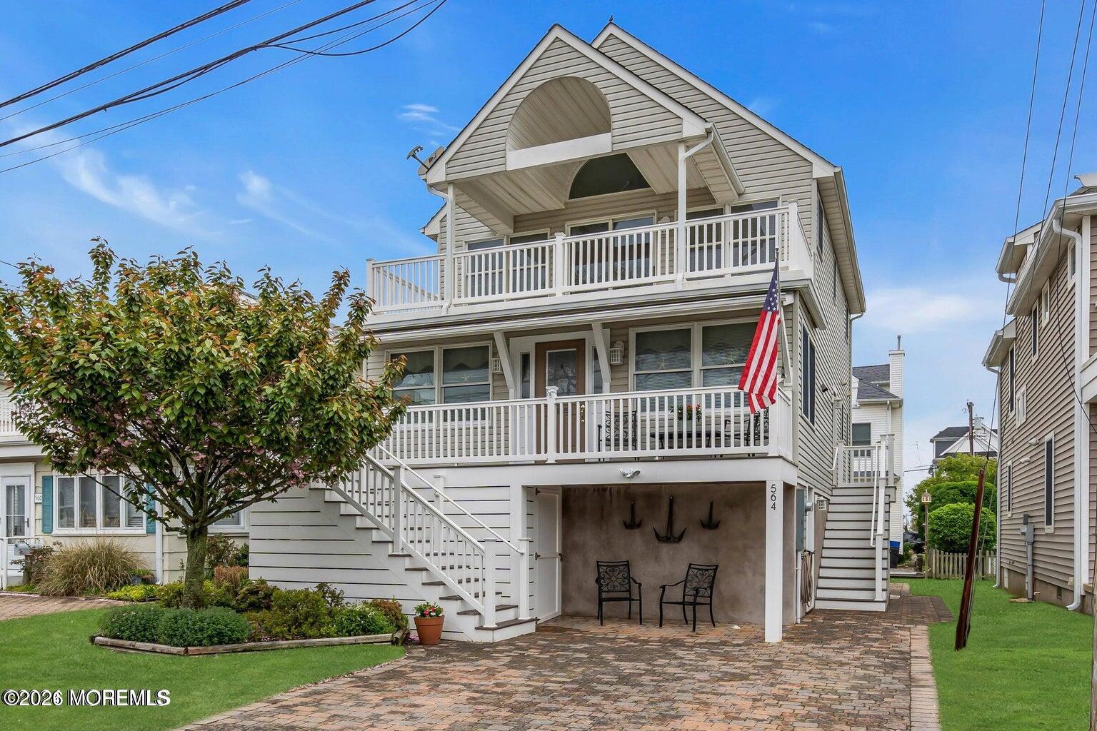 564 Perch Avenue Manasquan, NJ 08736 - Photo 5 of 15 a front view of a house with a yard