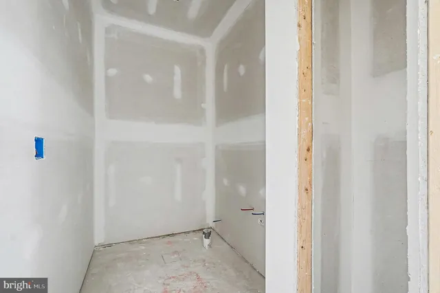 a view of a bathroom with a glass shower door