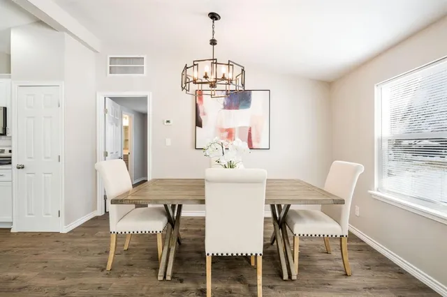 a view of a dining room with furniture window and wooden floor