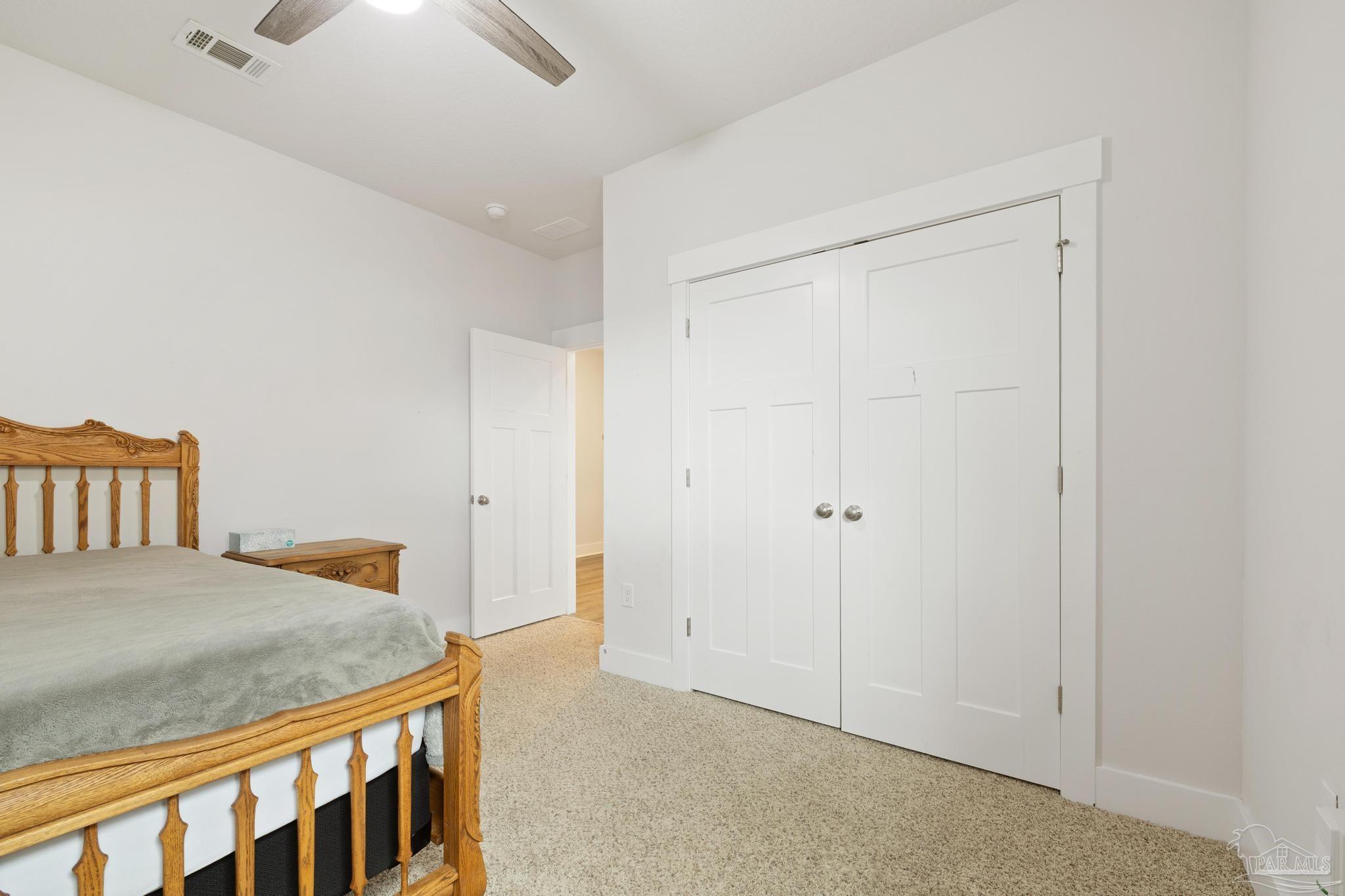 2635 Ten Mile Road Pace, FL 32571 - Photo 12 of 67 a bedroom with a bed and a dresser