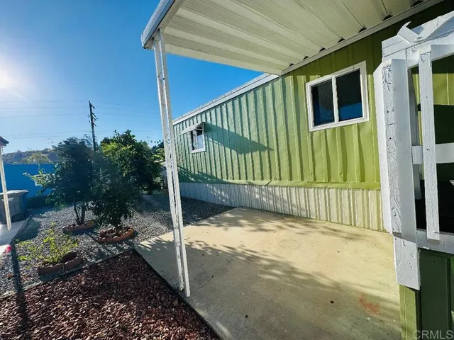 a view of a porch with a small yard