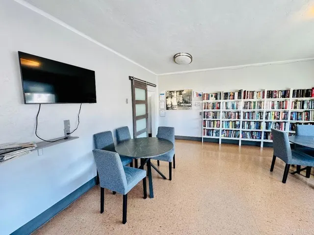 a living room with furniture and a table