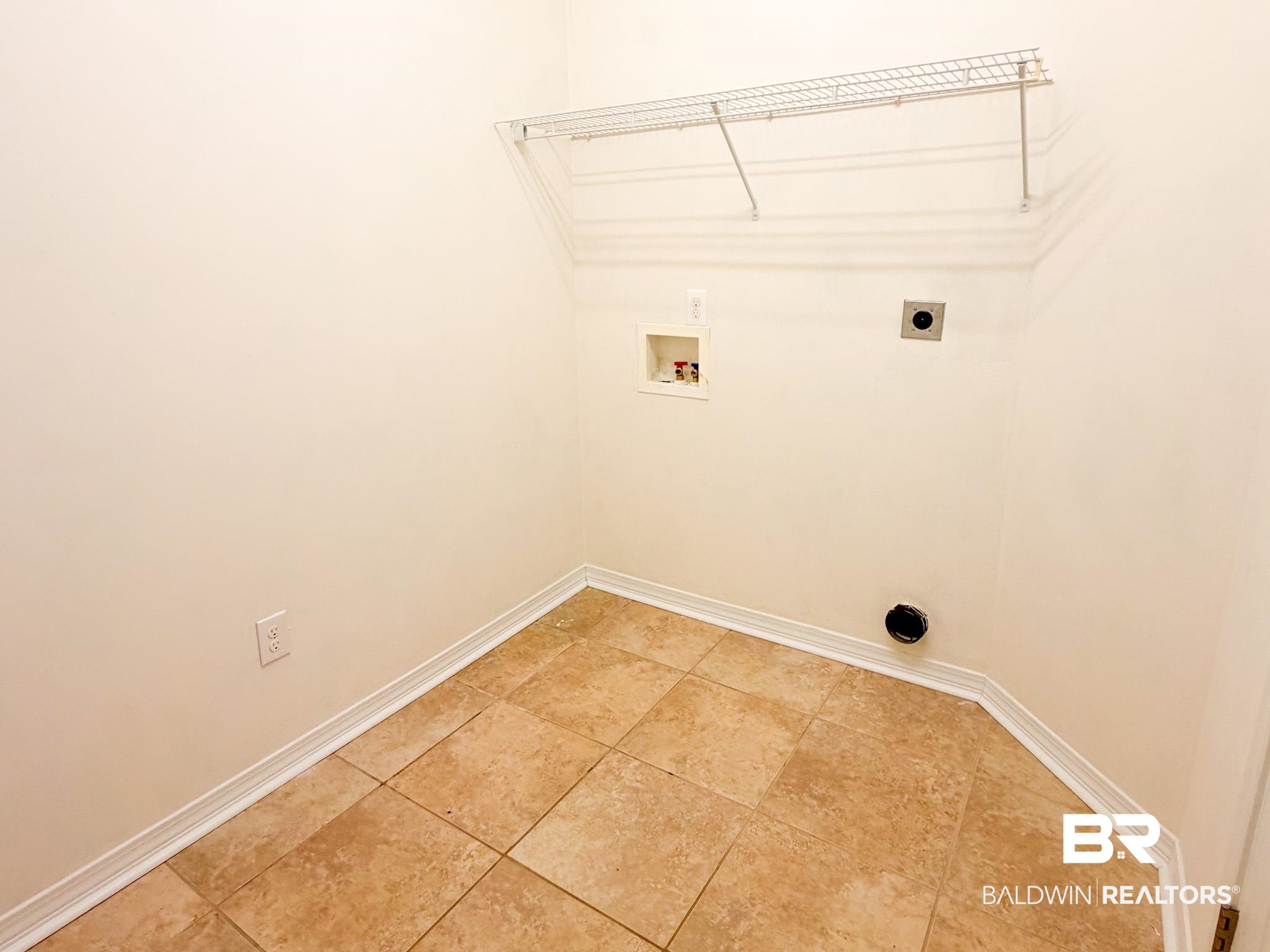 7332 Raintree Lane Gulf Shores, AL 36542 - Photo 19 of 21 Laundry room with hookup for an electric dryer, hookup for a washing machine, and light tile patterned flooring