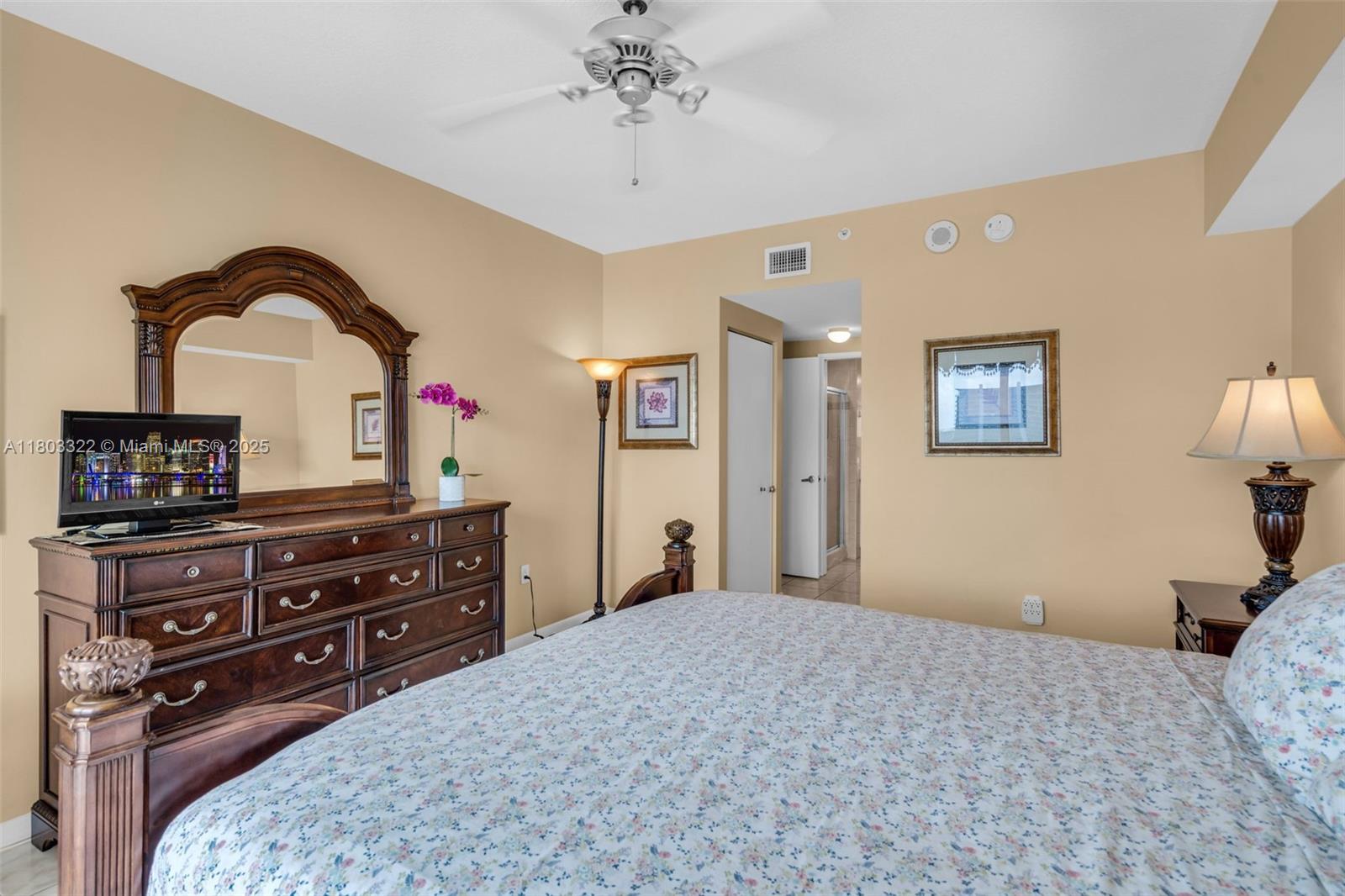 18100 North Bay Road, Unit 404 Sunny Isles Beach, FL 33160 - Photo 17 of 34 a bedroom with a bed and a dresser