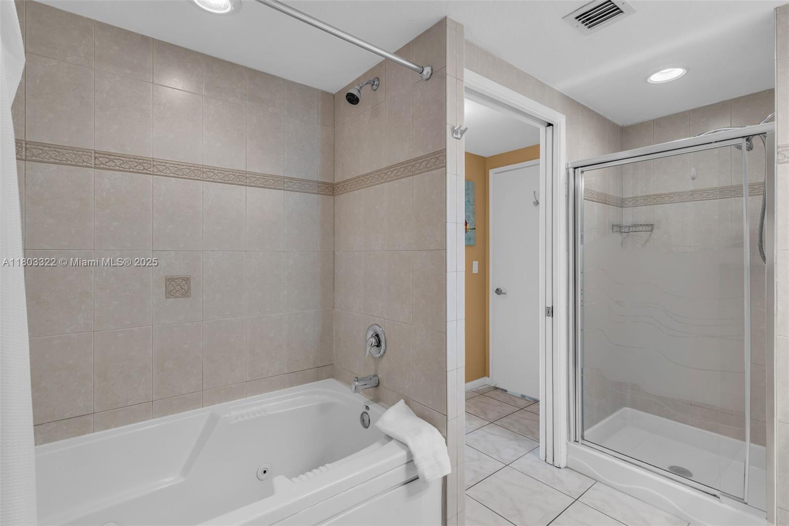 18100 North Bay Road, Unit 404 Sunny Isles Beach, FL 33160 - Photo 19 of 34 a bathroom with a bathtub and a shower