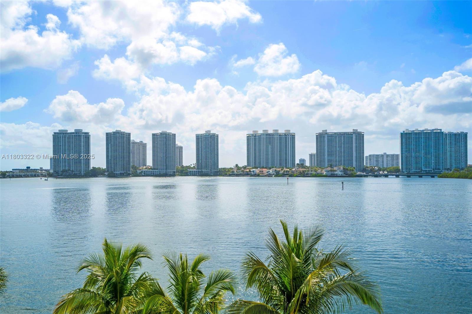 18100 North Bay Road, Unit 404 Sunny Isles Beach, FL 33160 - Photo 27 of 34 a view of a city with a lake