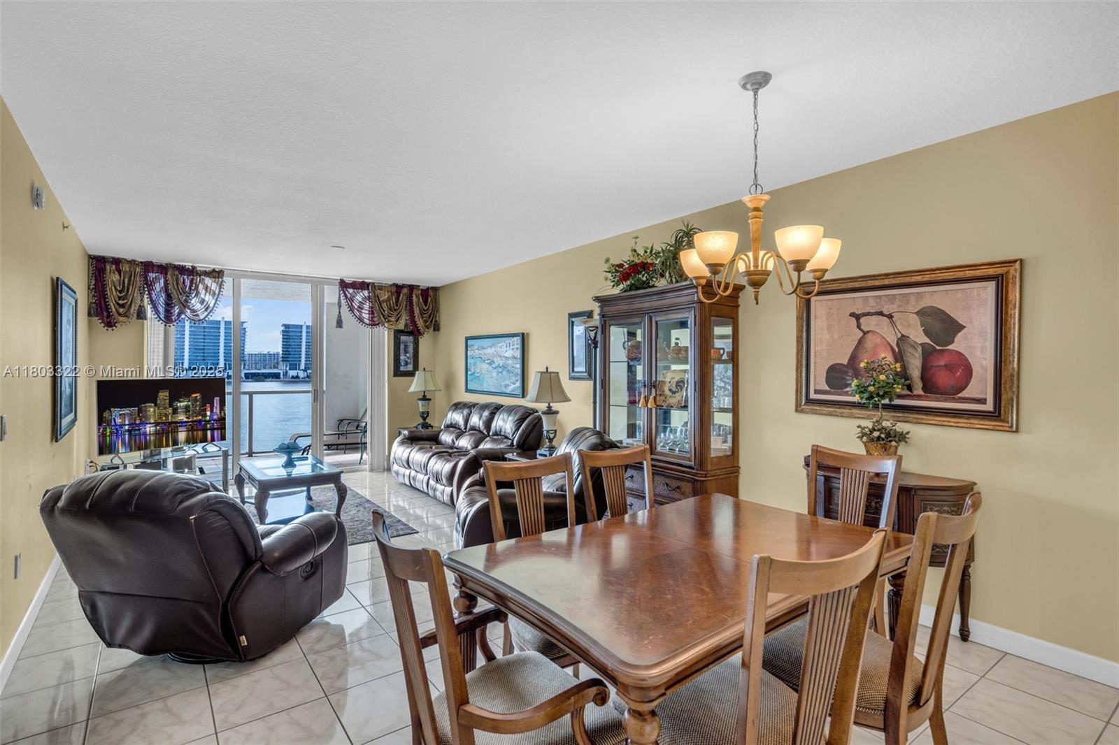 18100 North Bay Road, Unit 404 Sunny Isles Beach, FL 33160 - Photo 5 of 34 a view of a dining room with furniture