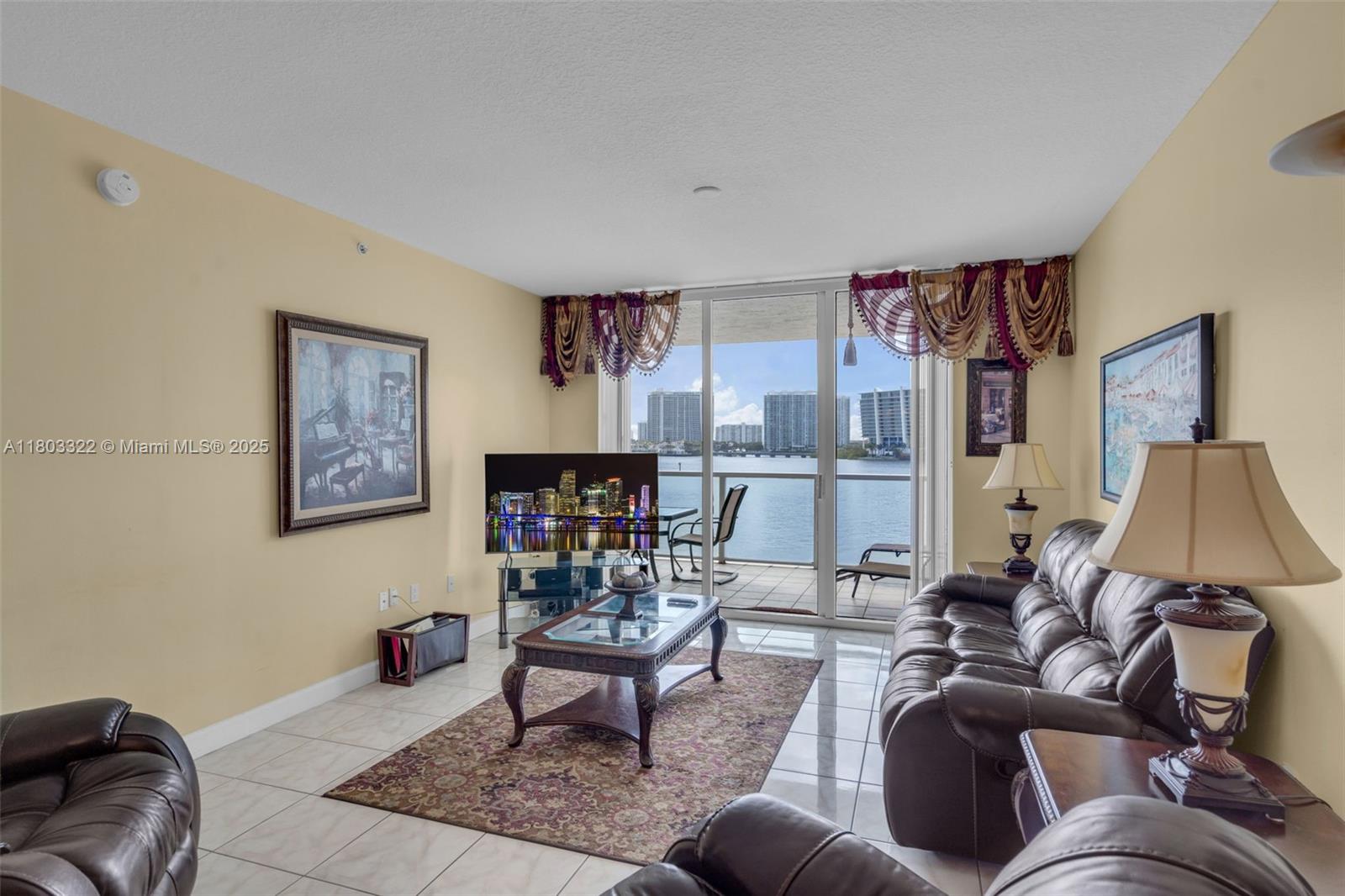18100 North Bay Road, Unit 404 Sunny Isles Beach, FL 33160 - Photo 7 of 34 a living room with furniture