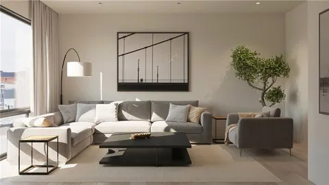 a living room with furniture and a potted plant