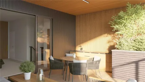 a balcony with table and chairs