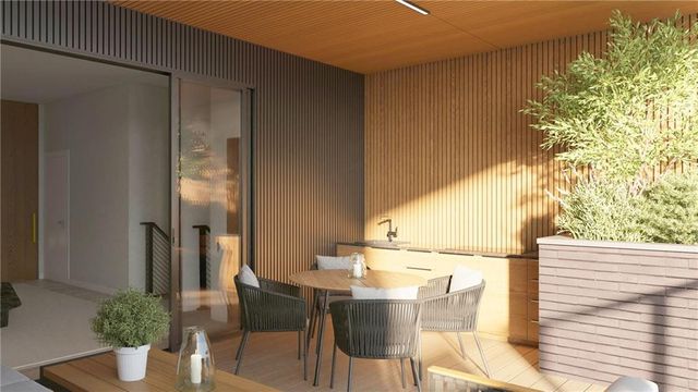 a balcony with table and chairs