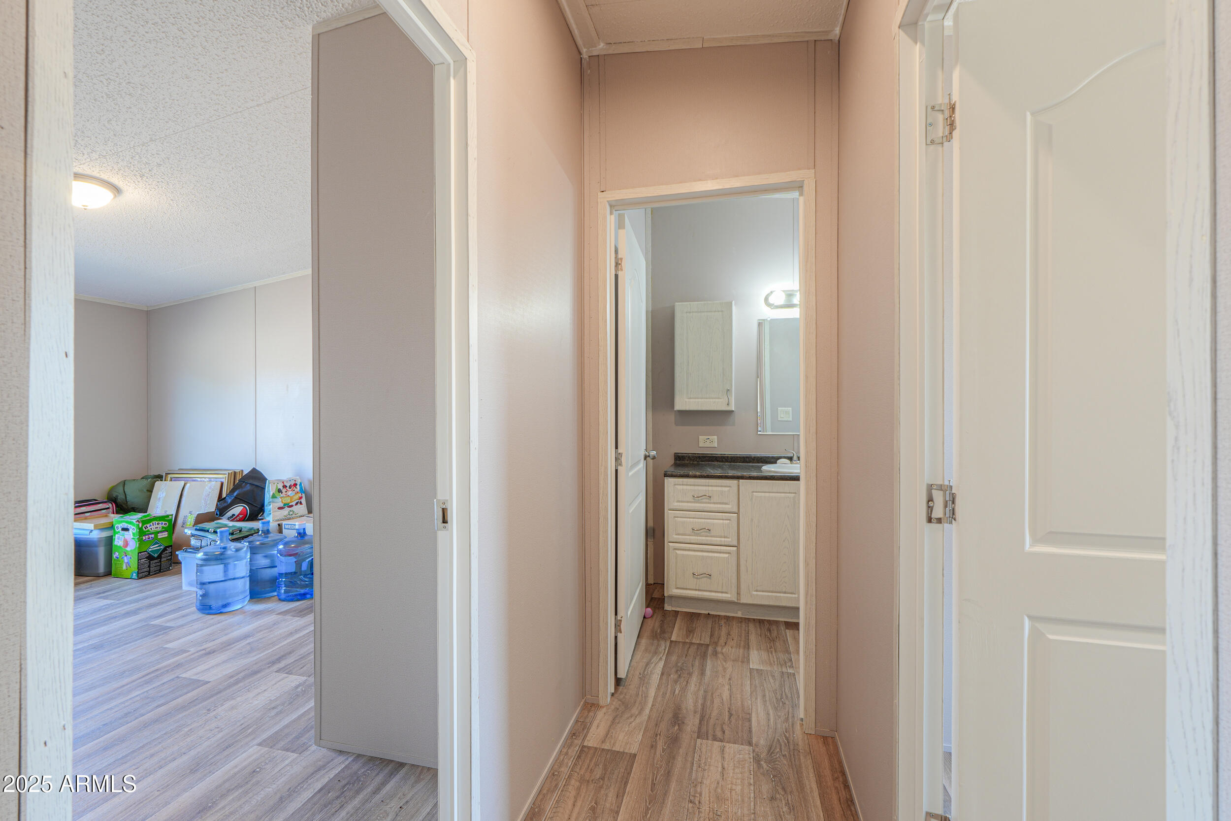 11091 North Garduno Road Maricopa, AZ 85139 - Photo 15 of 51 a view of a hallway with wooden floor