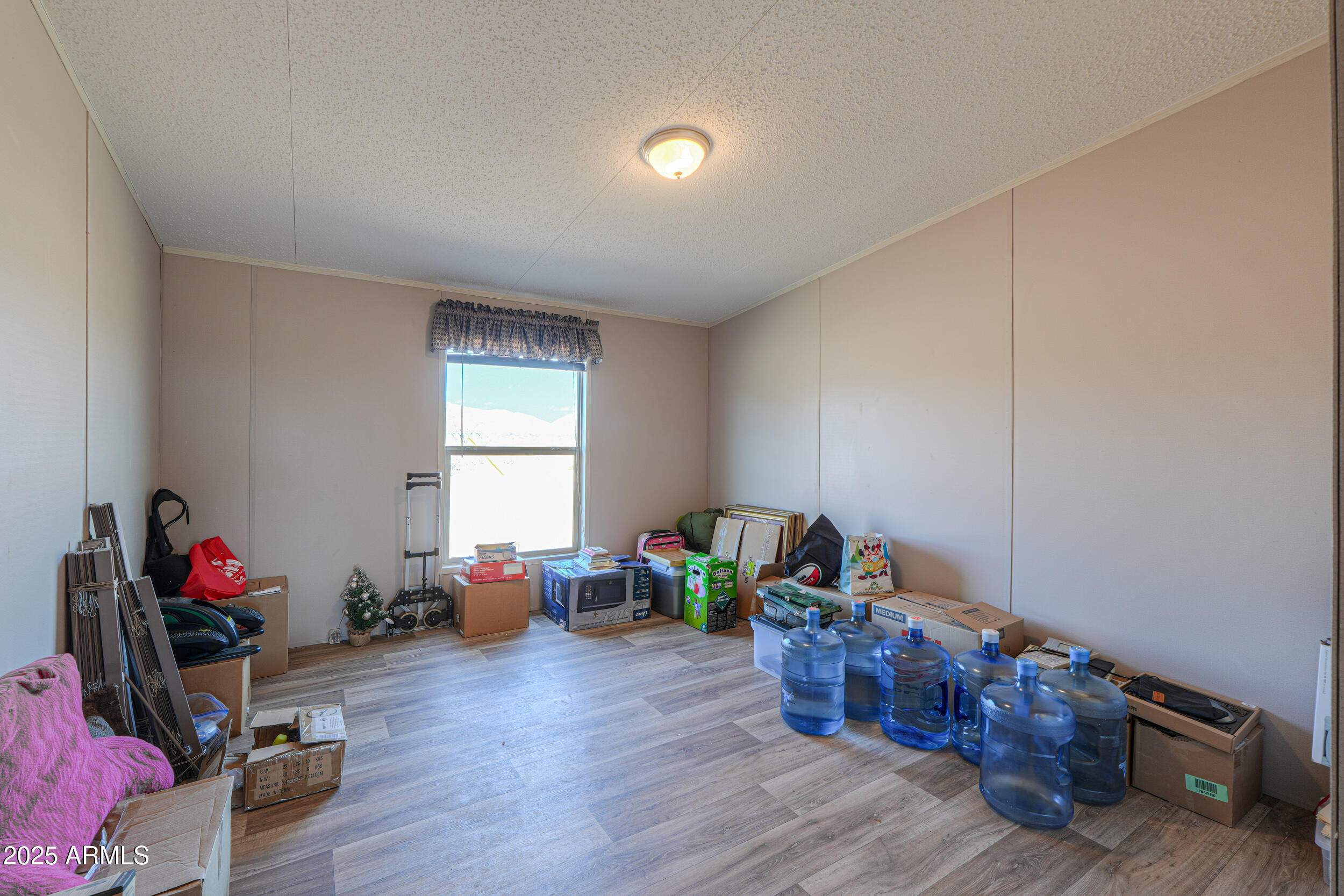 11091 North Garduno Road Maricopa, AZ 85139 - Photo 16 of 51 a living room with furniture and a wooden floor