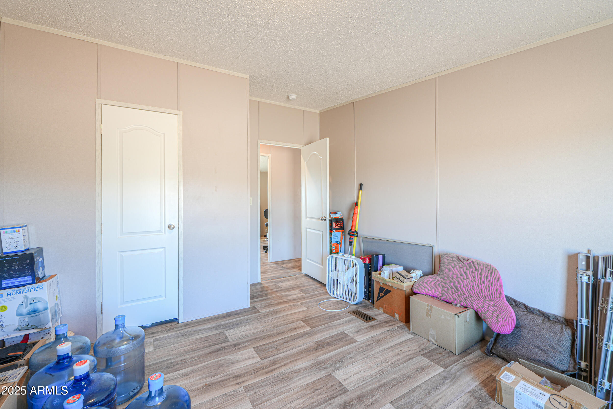 11091 North Garduno Road Maricopa, AZ 85139 - Photo 17 of 51 a bed room with a bed and a window