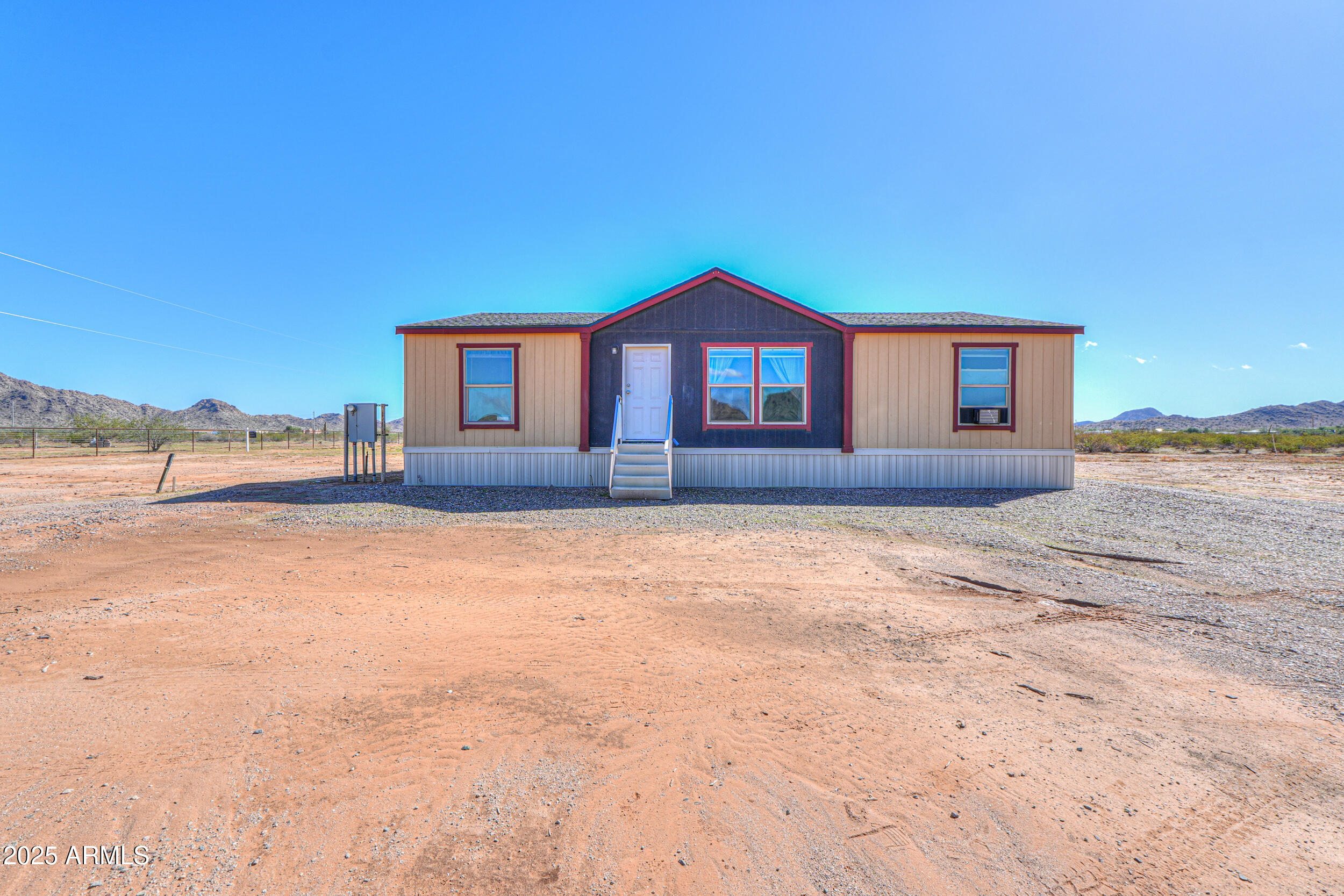 11091 North Garduno Road Maricopa, AZ 85139 - Photo 2 of 51 a front view of a house with a yard