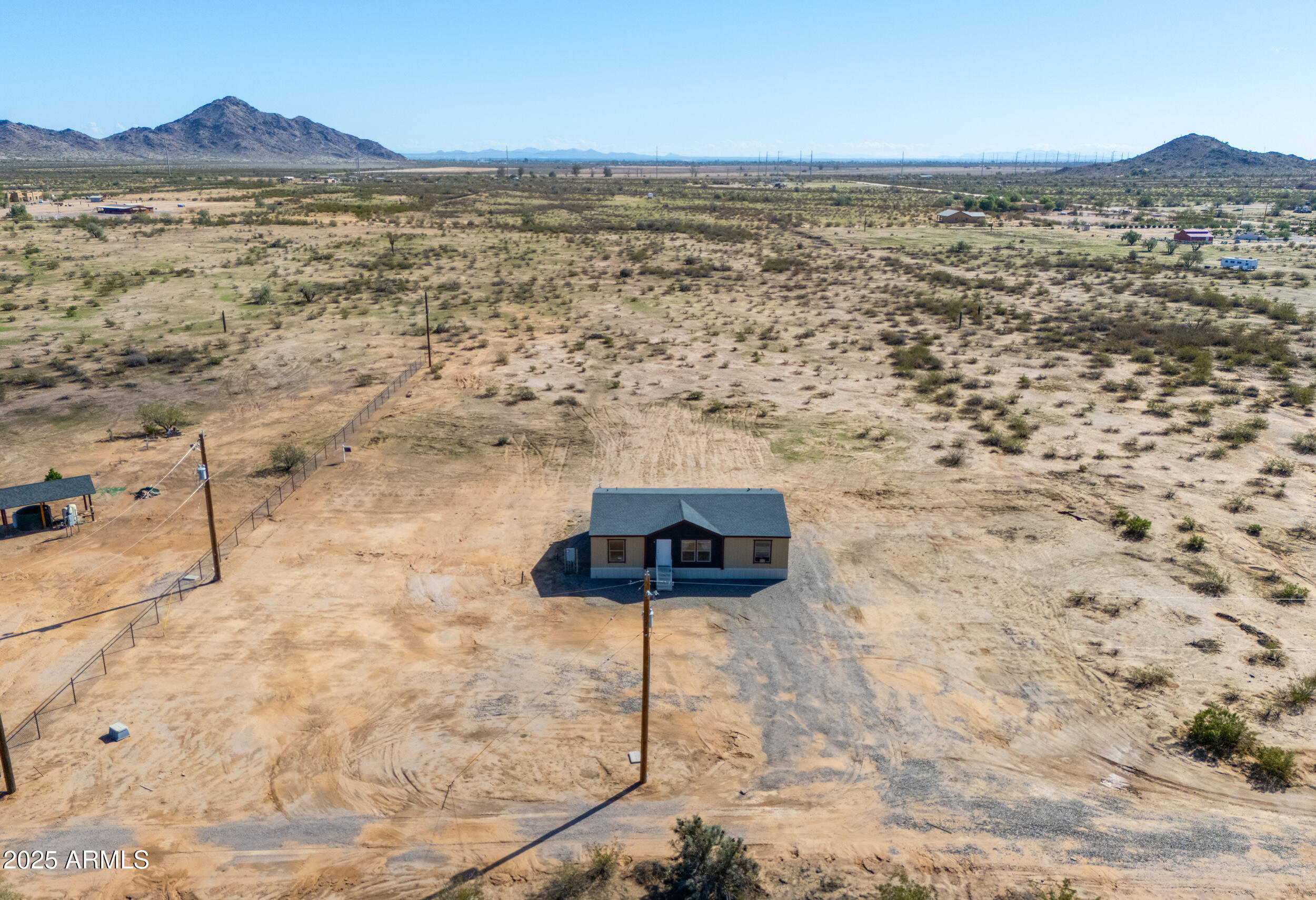 11091 North Garduno Road Maricopa, AZ 85139 - Photo 36 of 51 a view of an ocean beach and mountain