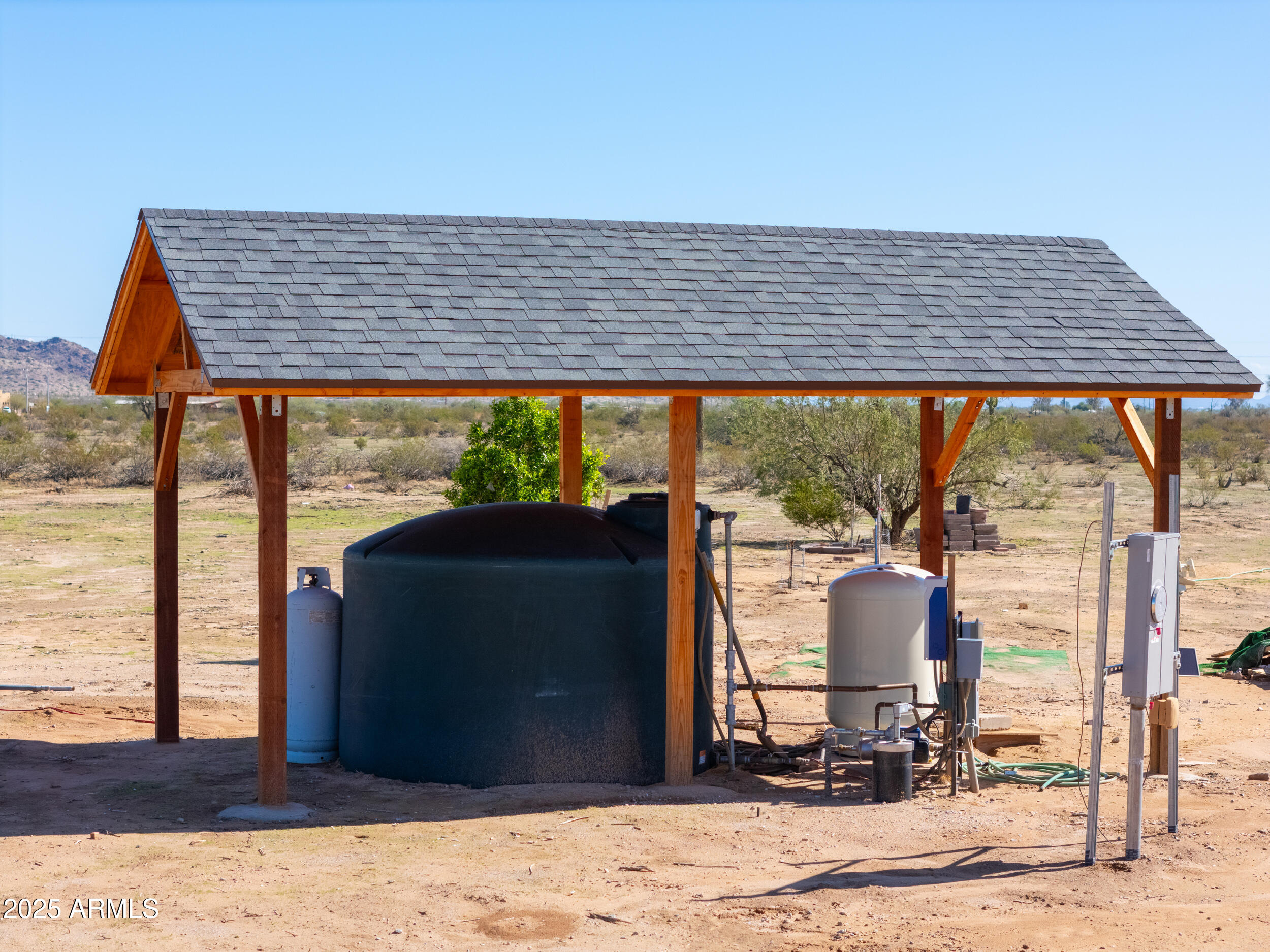 11091 North Garduno Road Maricopa, AZ 85139 - Photo 51 of 51 a backyard of a house with wooden floor a barbeque oven and outdoor seating